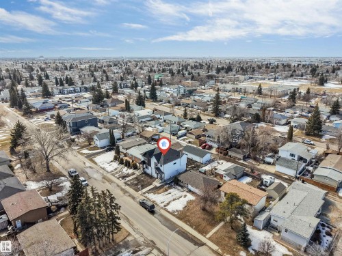 The property is situated in a neighbourhood characterized by detached residential homes and mature trees - 10964 157 Street, Edmonton, AB - Outdoor With View