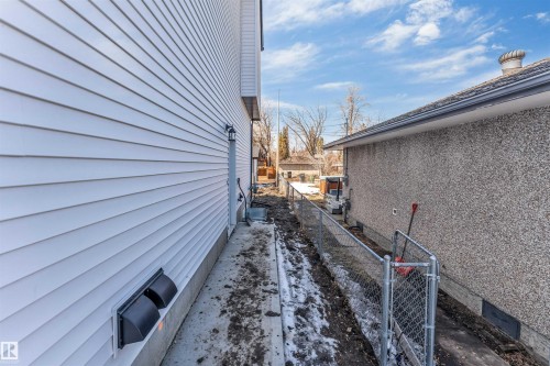 The property features white horizontal siding and a concrete foundation - 10964 157 Street, Edmonton, AB - Outdoor