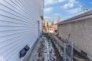 The property features white horizontal siding and a concrete foundation - 10964 157 Street, Edmonton, AB  - Outdoor 