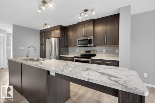 35 Prairie Gate, Spruce Grove, AB - Indoor Photo Showing Kitchen With Stainless Steel Kitchen With Double Sink With Upgraded Kitchen