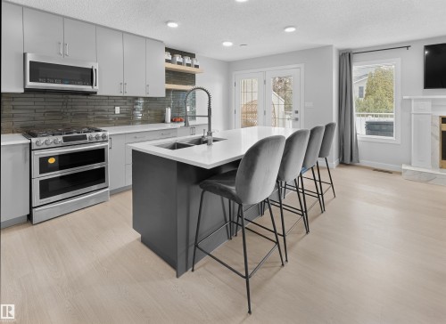 4636 151 Street, Edmonton, AB - Indoor Photo Showing Kitchen With Fireplace With Double Sink With Upgraded Kitchen