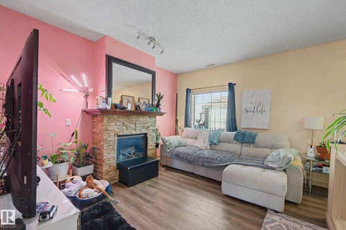 92 13825 155 Avenue, Edmonton, AB - Indoor Photo Showing Living Room With Fireplace