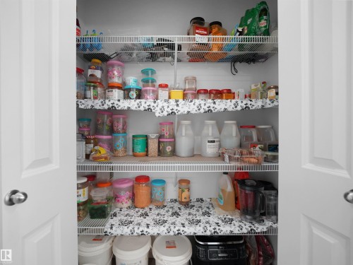 A spacious pantry featuring white wire shelving and a white interior - 1304 14 Avenue, Edmonton, AB - Indoor
