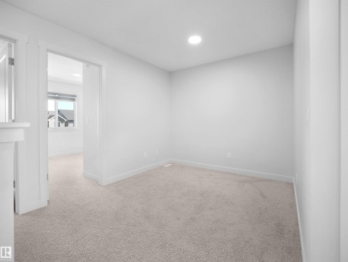 This room features light-colored carpeting, white walls, and recessed lighting - 1304 14 Avenue, Edmonton, AB - Indoor Photo Showing Other Room