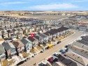 Aerial view of the property and surrounding neighborhood, featuring a residential street with parked vehicles - 1304 14 Avenue, Edmonton, AB  - Outdoor With View 