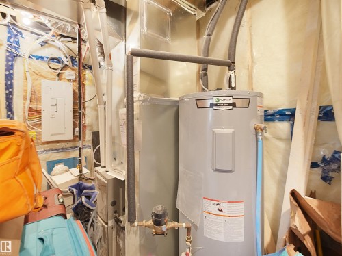 The property features a water heater and electrical panel - 1304 14 Avenue, Edmonton, AB - Indoor Photo Showing Basement