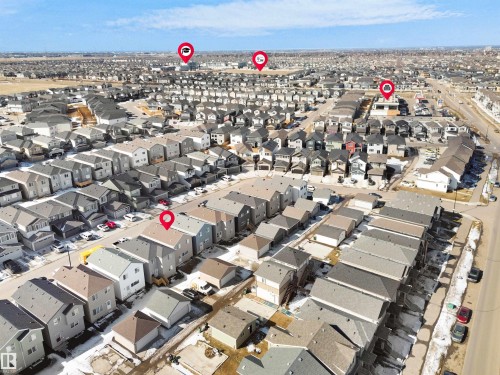 Aerial view of the surrounding residential area featuring numerous detached properties and townhomes with grey roofs - 1304 14 Avenue, Edmonton, AB - Outdoor With View