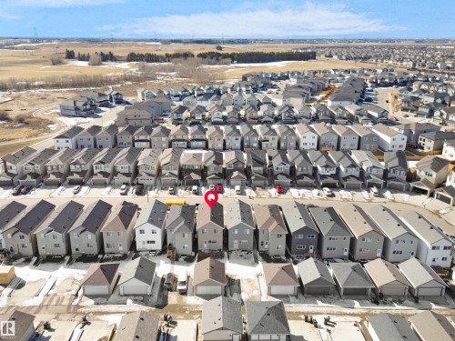Aerial view of the property and surrounding neighborhood, featuring residential homes with attached garages and visible driveways - 1304 14 Avenue, Edmonton, AB - Outdoor With View