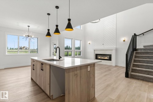 153 Caledon Crescent, Spruce Grove, AB - Indoor Photo Showing Kitchen With Fireplace With Upgraded Kitchen