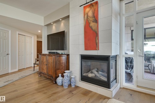 1003 9020 Jasper Avenue, Edmonton, AB - Indoor With Fireplace