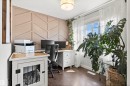 This room features wood-look flooring and a decorative accent wall with geometric paneling - 38 Hewitt Circle, Spruce Grove, AB  - Indoor Photo Showing Office 