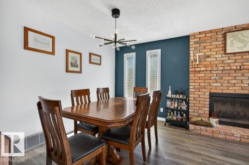 17525 92 Street, Edmonton, AB - Indoor Photo Showing Dining Room With Fireplace