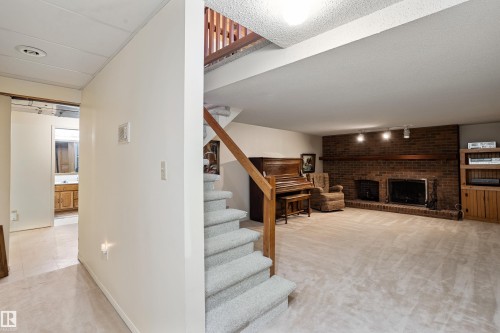 258 Greenoch Crescent, Edmonton, AB - Indoor Photo Showing Other Room With Fireplace