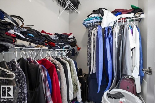 Walk-in closet featuring wire shelving and hanging rods - 204 Charlesworth Drive, Edmonton, AB - Indoor With Storage