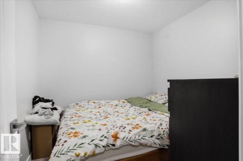 The property features an interior room with white walls and a white ceiling - 204 Charlesworth Drive, Edmonton, AB - Indoor Photo Showing Bedroom