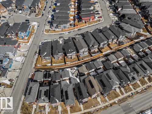 Aerial view of the neighborhood showcasing numerous properties with dark roofs and some with solar panels - 204 Charlesworth Drive, Edmonton, AB - Other