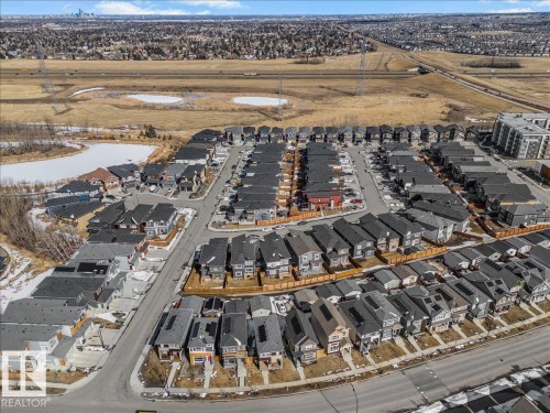 The property is situated within a developed residential area featuring various home designs and layouts, including a mixture of single-family residences and multi-story buildings - 204 Charlesworth Drive, Edmonton, AB - Outdoor With View