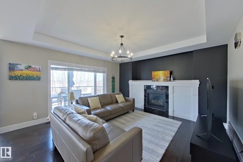 5512 64 Street, Beaumont, AB - Indoor Photo Showing Living Room With Fireplace