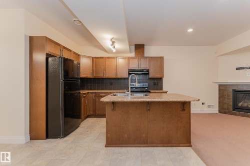 5512 Conestoga, Edmonton, AB - Indoor Photo Showing Kitchen With Fireplace