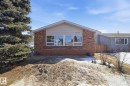 The property features a brick and siding exterior, with a prominent front window - 4129 134A Avenue Nw, Edmonton, AB  - Outdoor 