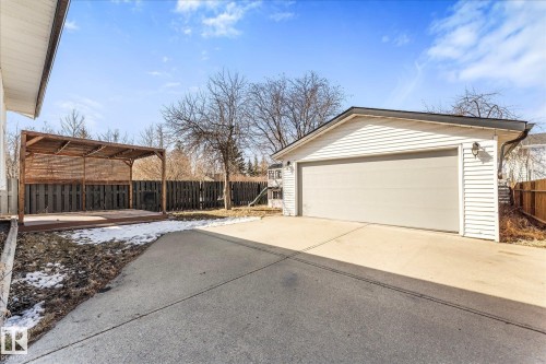 The property includes a detached garage with white siding and a light-colored garage door - 2626 49 Street, Edmonton, AB - Outdoor With Exterior