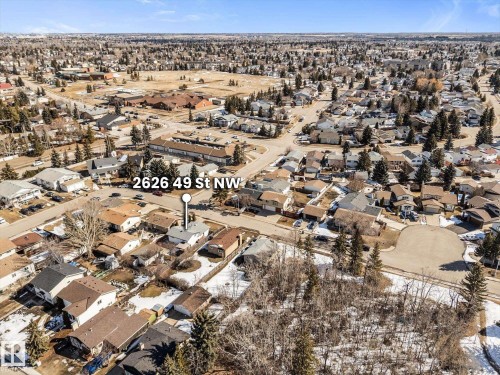 Aerial view of the surrounding neighborhood, featuring numerous residential properties with various roof styles and a clear sky overhead - 2626 49 Street, Edmonton, AB - Outdoor With View