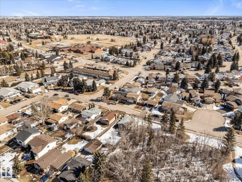 Aerial view of the neighborhood showcasing residential properties with varied roof styles and surrounding trees - 2626 49 Street, Edmonton, AB - Outdoor With View