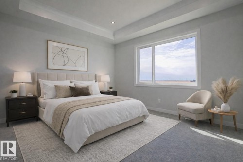 This room features a window with a view of the sky and expansive landscape, a tray ceiling, and recessed lighting - Rural Leduc County, AB - Indoor Photo Showing Bedroom