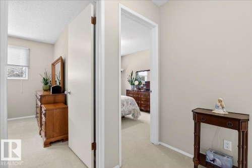 The property offers a neutral color palette throughout, with light-colored walls and carpeted flooring - 391 Lee Ridge Road, Edmonton, AB - Indoor Photo Showing Other Room