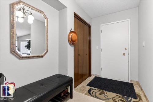 The property features an entryway with light-colored walls and a front door - 391 Lee Ridge Road, Edmonton, AB - Indoor Photo Showing Other Room