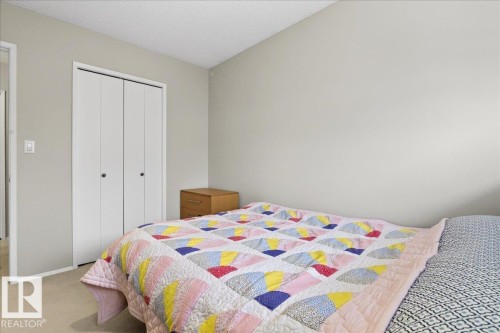 The property includes a bedroom with light-colored walls and carpet flooring - 391 Lee Ridge Road, Edmonton, AB - Indoor Photo Showing Bedroom