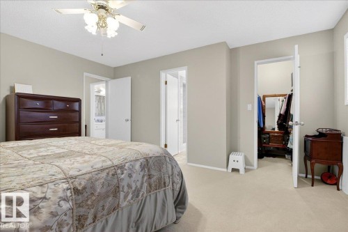Bedroom with light-colored walls, carpeted flooring, and a ceiling fan with light fixture - 391 Lee Ridge Road, Edmonton, AB - Indoor Photo Showing Bedroom
