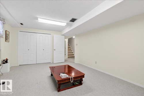 The property features light-colored carpeting, white walls, and a white ceiling with recessed lighting - 391 Lee Ridge Road, Edmonton, AB - Indoor Photo Showing Other Room