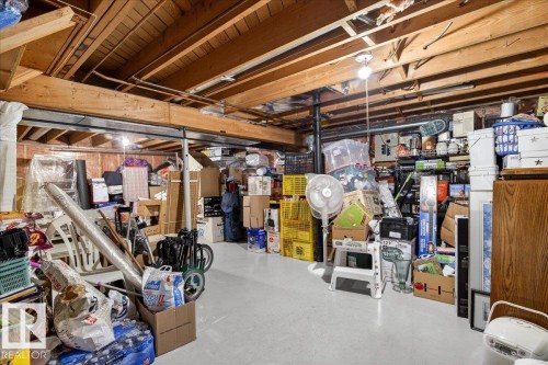 The property features an unfinished basement with exposed wooden joists and a concrete floor - 391 Lee Ridge Road, Edmonton, AB - Indoor Photo Showing Basement