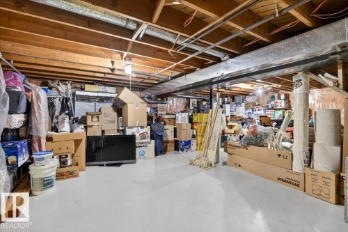 Spacious unfinished basement with exposed wooden beams, ductwork, and a concrete floor - 391 Lee Ridge Road, Edmonton, AB - Indoor Photo Showing Basement