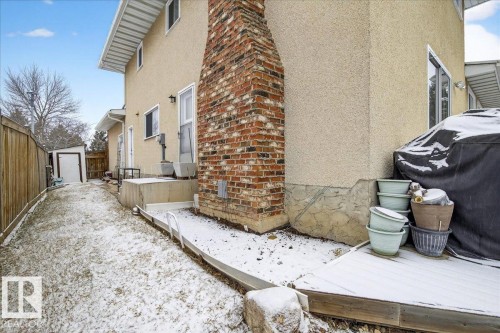 The property features an exterior with stucco siding and a prominent brick chimney - 391 Lee Ridge Road, Edmonton, AB - Outdoor