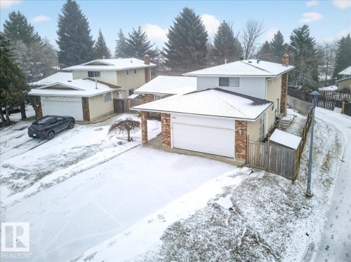 The property features a two-story home with an attached garage, a paved driveway, and a fenced yard - 391 Lee Ridge Road, Edmonton, AB - Outdoor