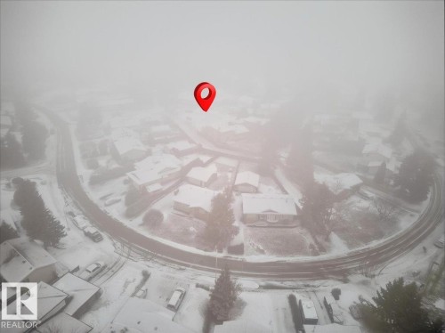 Aerial view of a residential neighborhood with snow-covered rooftops and streets - 391 Lee Ridge Road, Edmonton, AB -  With View