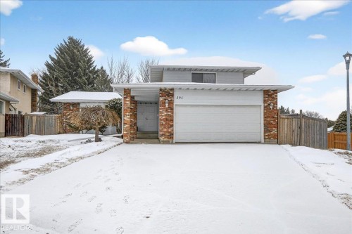 The property features a brick façade, an attached garage, and a covered entry - 391 Lee Ridge Road, Edmonton, AB - Outdoor