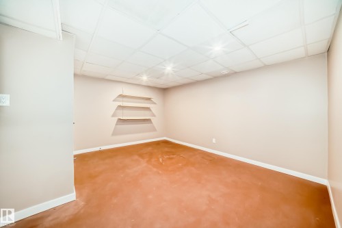 This versatile room features neutral-toned walls, recessed lighting, and a drop ceiling - 287 Lago Lindo Crescent, Edmonton, AB - Indoor Photo Showing Other Room