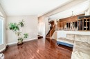 This inviting living space features warm hardwood flooring and a brightly lit interior - 287 Lago Lindo Crescent, Edmonton, AB  - Indoor 