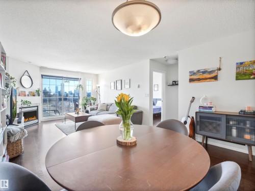 401 12110 106 Avenue, Edmonton, AB - Indoor Photo Showing Dining Room With Fireplace