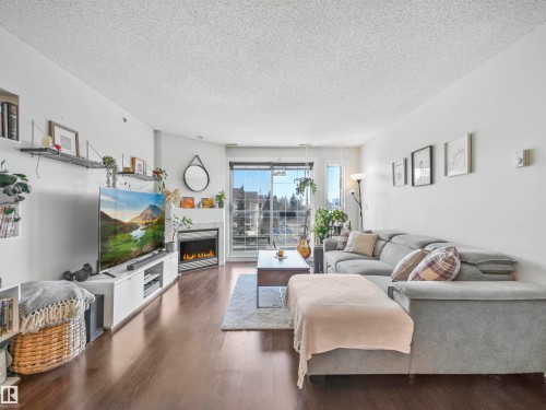 401 12110 106 Avenue, Edmonton, AB - Indoor Photo Showing Living Room With Fireplace