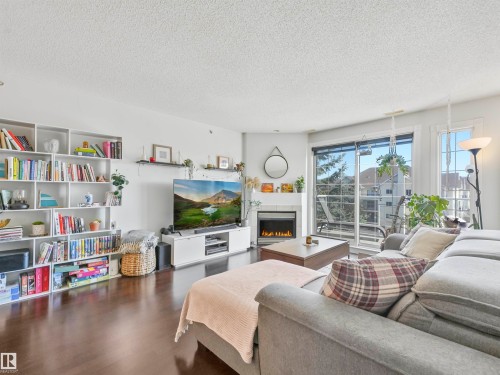 401 12110 106 Avenue, Edmonton, AB - Indoor Photo Showing Living Room With Fireplace