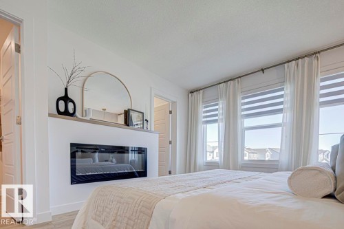 18705 18A Avenue, Edmonton, AB - Indoor Photo Showing Bedroom With Fireplace