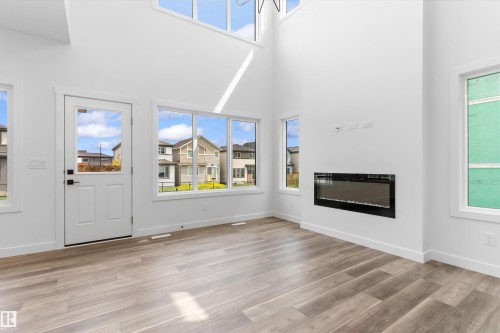 5005 Cawsey Link Sw, Edmonton, AB - Indoor Photo Showing Other Room With Fireplace