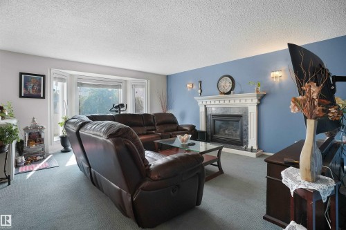 2715 44A Avenue, Edmonton, AB - Indoor Photo Showing Living Room With Fireplace