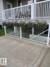 Ground-level patio with concrete surfacing and a glass-paneled barrier - 5 4902B 43 Street, Legal, AB 