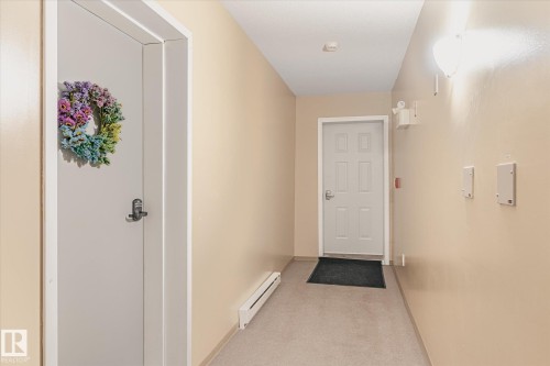 Inviting entryway with light-colored walls and carpeted flooring - 5 4902B 43 Street, Legal, AB 