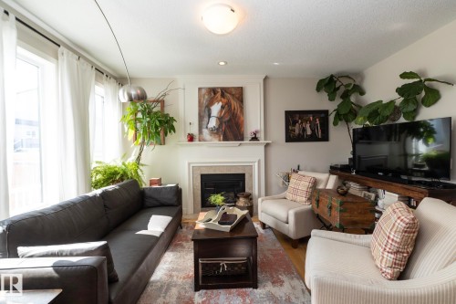 5315 17 Avenue, Edmonton, AB - Indoor Photo Showing Living Room With Fireplace